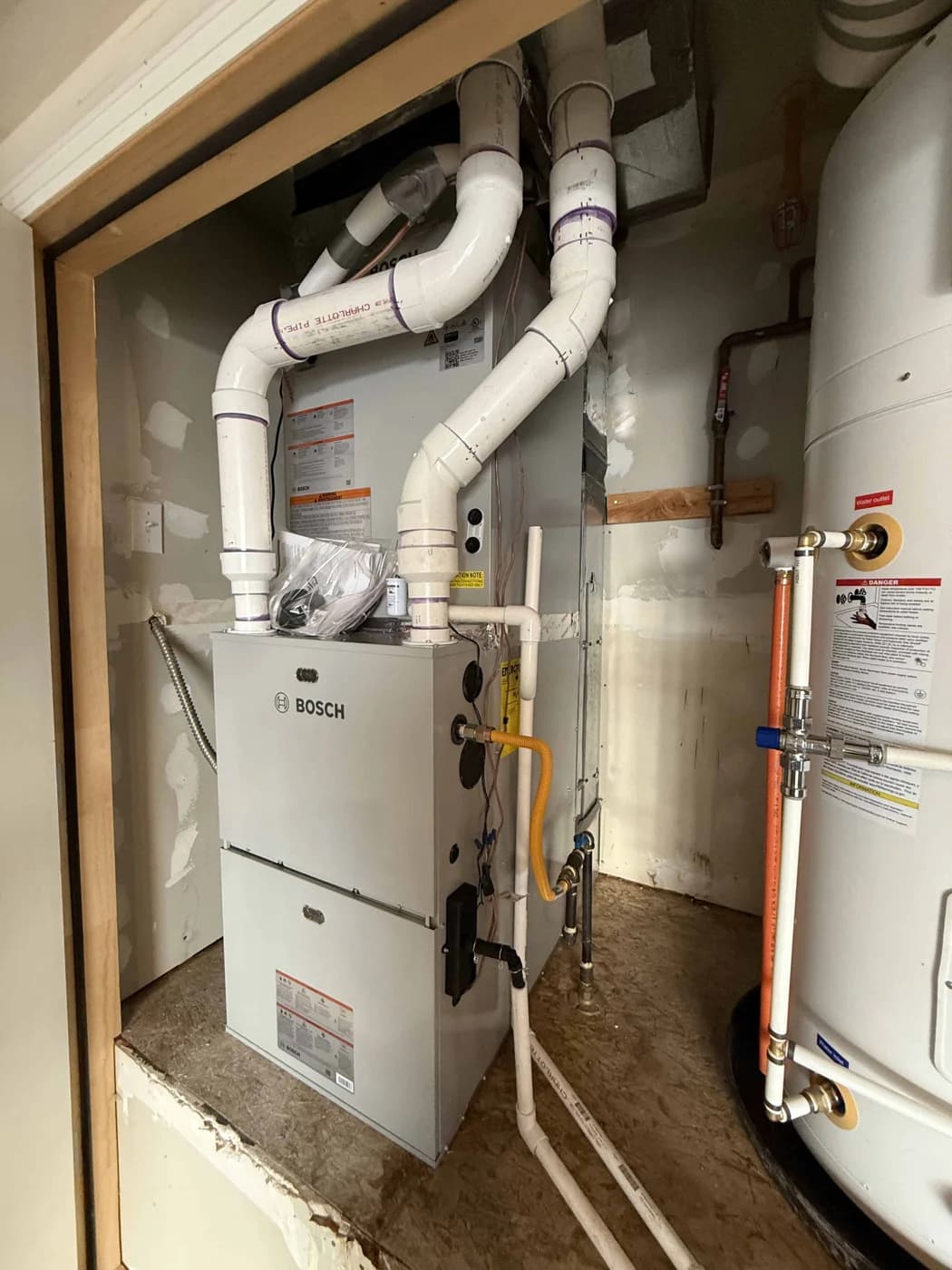 Furnace and water heater installed inside a utility closet